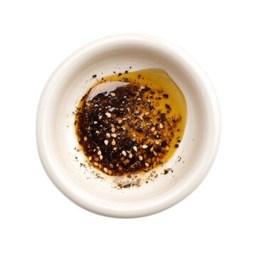 Small ceramic bowl with oil and za&rsquo;atar on plate