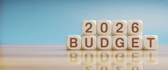 Wooden toy cubes forming the text "2026 BUDGET". Concept for planning the yearly budget for 2026.
