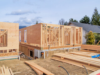 Wooden frame of new building with engineered lumber materials in front