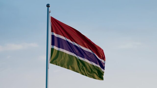 Gambia Banjul Flag Cinematic Realistic Waving Dolly Out Blue Sky