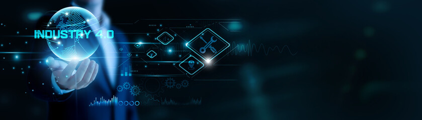 Businessman hand hold Industry 4.0 and global networking, transforming smart manufacturing. IoT and automation connect systems, boosting production efficiency.