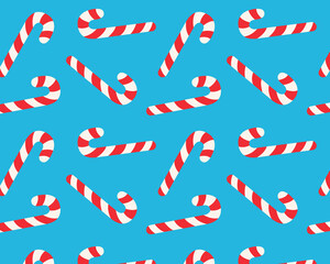 Seamless striped lollipop pattern. Christmas candy cane. Isolated blue background. Vector illustration.