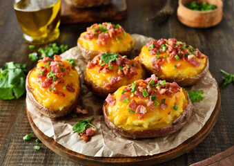 Baked stuffed potatoes with bacon, green onion and cheddar cheese