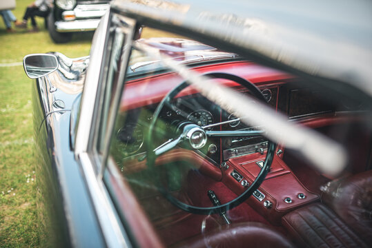Classic car interior with red leather and chrome details - Powered by Adobe