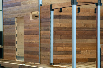 Assembling a wooden house, Swiss style