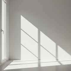 Obraz premium Bright sunlight streaming through a large window illuminating a perfectly clean white wall with sharp architectural shadows, home, vertical, illuminated