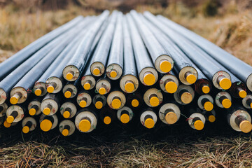 Stack of Industrial Steel Pipes Outdoors