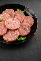 Sausage with garlic and spices slices of salami meat tasty snack fresh gourmet food background on the table rustic food top view copy space