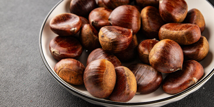 Edible chestnuts delicious treat tasty snack fresh gourmet food background on table rustic food top view copy space