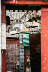 Narrow alleyway in a bustling Chinese city. A glimpse of everyday life and local culture.
