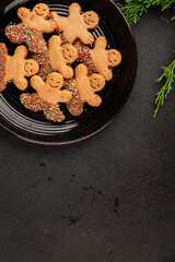 Gingerbread man cookies Christmas sweet dessert new year Christmas background tasty snack fresh delicious gourmet food background on the table rustic top view copy space