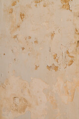 Peeling plaster wall texture with rough patterns and weathered surface; great for backgrounds, design assets and architectural details.