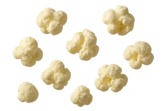 Popcorn kernels gracefully floating, a light and fluffy snack ready for consumer enjoyment, isolated on a transparent background