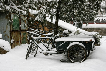 Snowy Street Scene in China with Bicycle and Cart