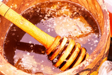 Natural sweet healthy honey in wooden barrels for sale. Healthy eating. Healthy lifestyle