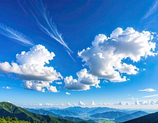 Expansive mountain vista under a brilliant blue sky with dramatic white clouds