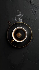 A steaming cup of black coffee on a dark, textured surface, with a gold rim