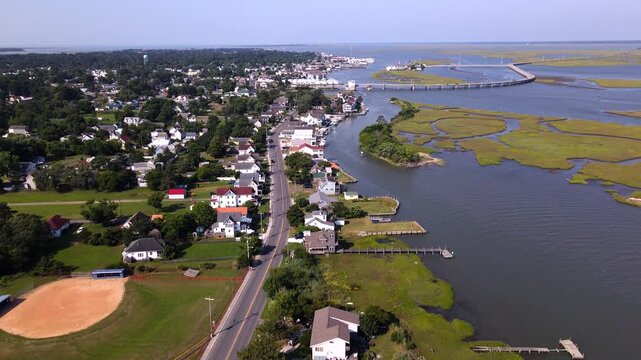 chincoteague coastal town real estate and seaside scenery. Drone moving along the shore.
