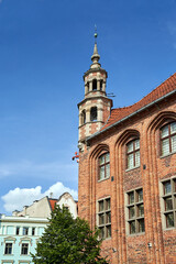 The tower of the Gothic, historic town hall in the market square in Torun