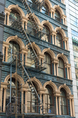 Cast iron facade with fire escapes