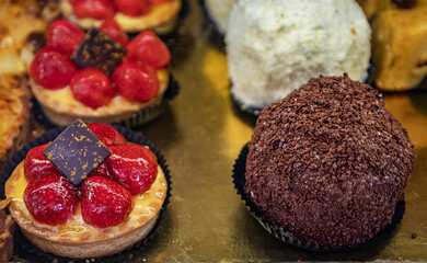 Delicate petit four desserts for sale at an artisanal bakery in Nice, France