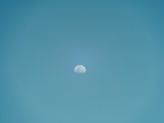 moon in the clear sky during the day