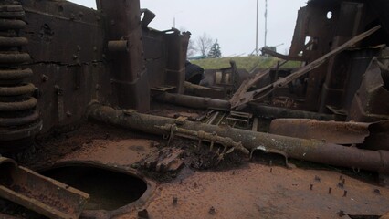 decay and neglect in vehicle, industrial ruin inside rusted military machinery showing neglect