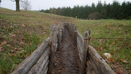 trail section being stabilized, restoration efforts involve timber supports and educational signs
