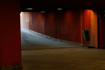 underpass with red wall