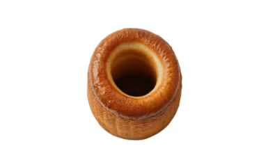 A top-view photograph of a traditional Hungarian kürtőskalács (chimney cake) centered on a clean white background. The golden-brown pastry displays its characteristic spiral ridged texture, with a cri