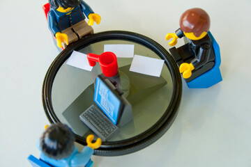 Obraz premium Lego Minifigure Team Meeting for Business Strategy