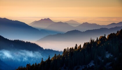 Obraz premium Mountain Ranges With Forest And Haze At Sunset