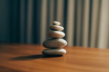 Stack of stones on wood table
