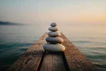 Stacked stones on a wooden dock
