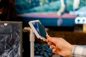 The process of paying with a bank card using a portable POS terminal.