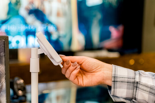 The process of paying with a bank card using a portable POS terminal. - Powered by Adobe