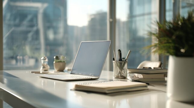 Modern workspace with laptop and greenery for a productive workday
