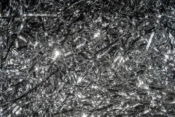 Abstract background of shiny silver tinsel foil © lazyllama