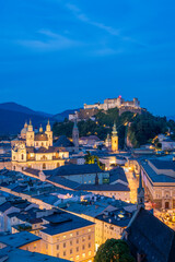 Fototapeta premium Illuminated Salzburg Old Town and Hohensalzburg Fortress at Evening Twilight. Austria. Blue Hour. Wide Shot
