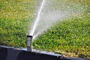 High-pressure water jet for watering green grass
