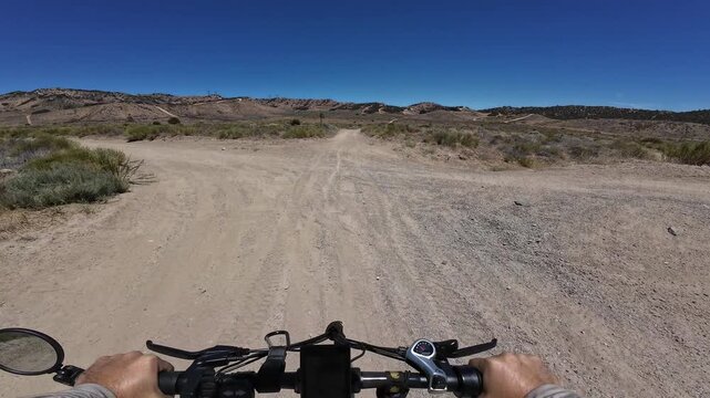 Dirt Bike and Electric Mountain Bike POV Shot of Hungry Valley CJ's Trail 3 Flat Road in Southern California USA