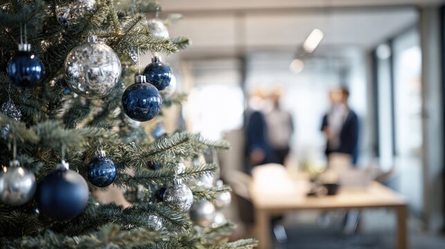 Festive Christmas Tree in Modern Office Setting with Business People in Background, Holiday Season