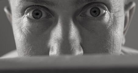 I see you too. Shot of an handsome young mans eyes against a studio background.