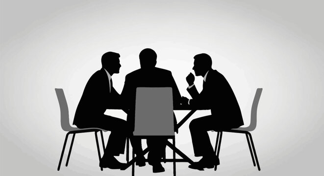 Silhouetted men in suits gathered around a table in a meeting