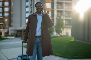 Smiling african american man commuting talking on cell phone