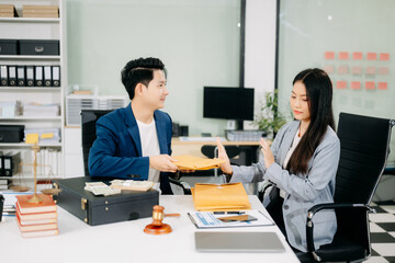  Lawyer refusing bribe money in the envelop from business man at the lawyer office.