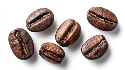 Isolated close-up of roasted coffee beans against a white background
