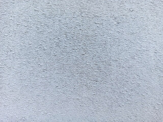 Textured Wall Surface: A close-up shot revealing the rough, tactile surface of a wall, where the imperfections become a focal point, the image plays with light and shadow.
