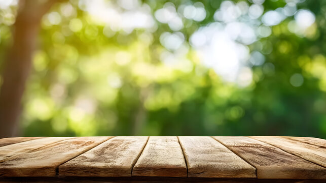 Empty wooden table with soft green forest background