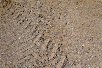 Tractor Tire Tracks in Dirt and Gravel on a Rural Farm Path